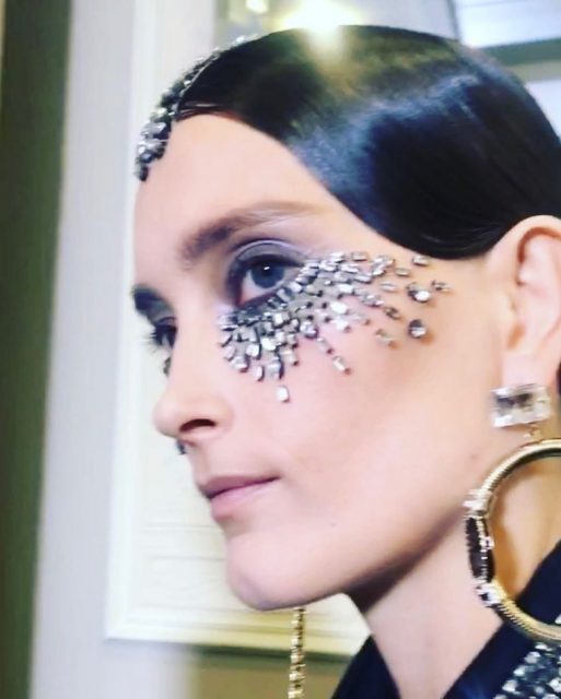 Schiaparelli Couture Serves Up Glitter Lips, Fringed Headpieces, and Art Deco Face Decals